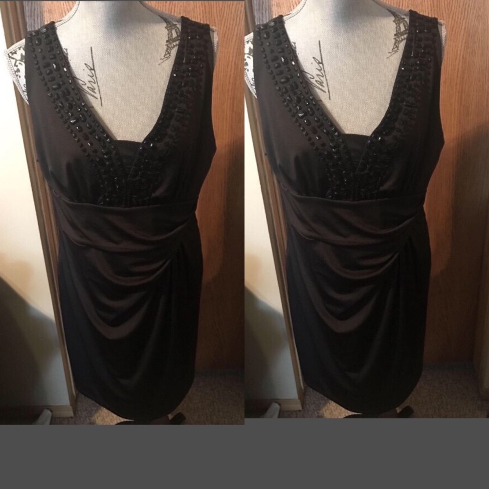 black sleeveless dress With beads around neck line